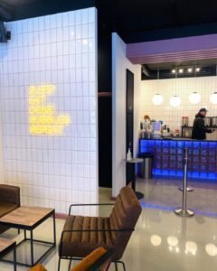 Warm white LED neon text sign in a café interior