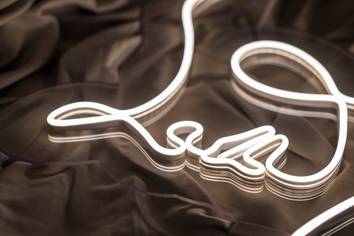 White female profile line-art LED neon sign